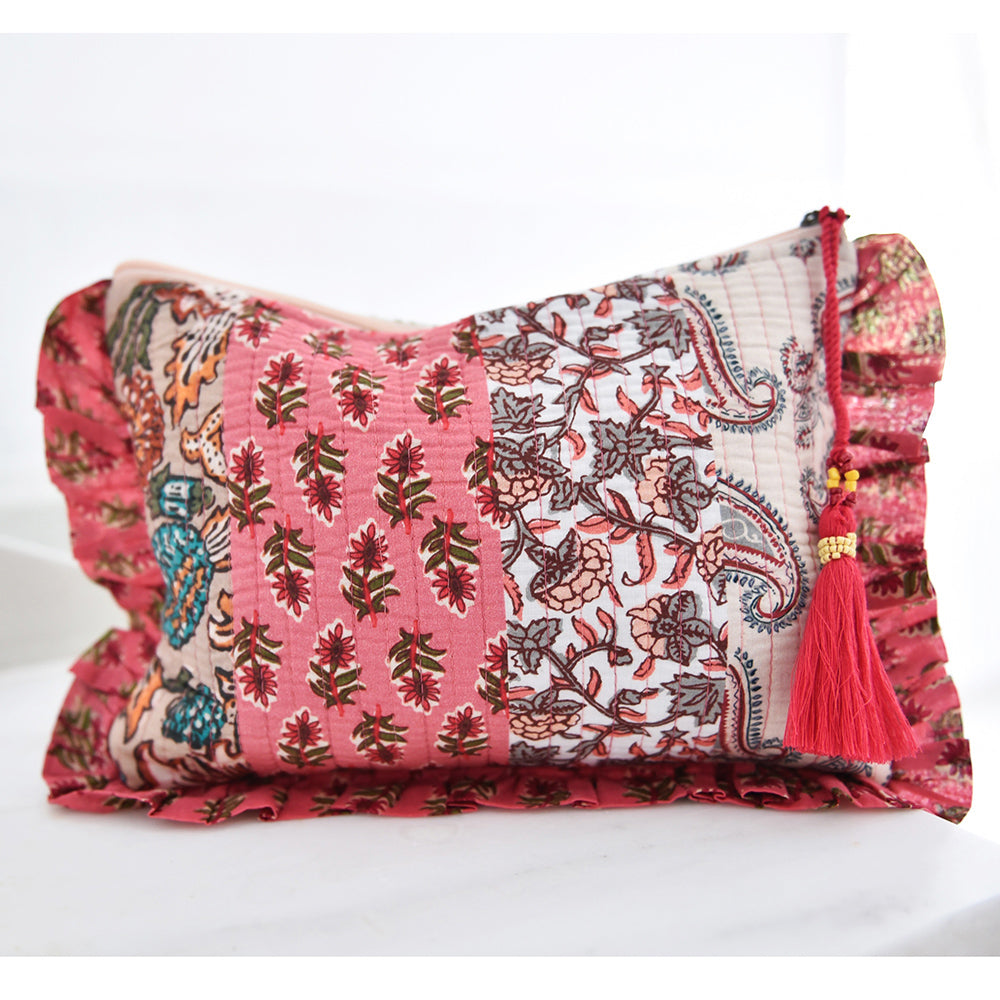 Patchwork makeup bag with pink floral and paisley print.
