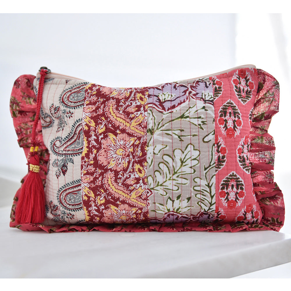 Patchwork makeup bag with pink floral and paisley print.