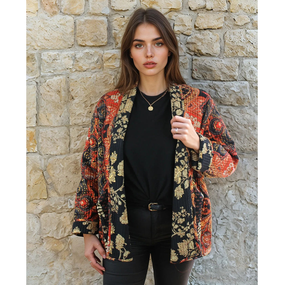 Quilted reversible jacket with gold floral pattern.