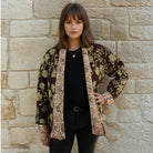Brown, gold and white reversible quilted jacket.