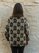 Black and gold reversible printed cotton quilted jacket.