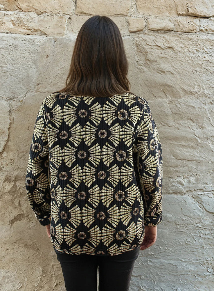 Black and gold reversible printed cotton quilted jacket.