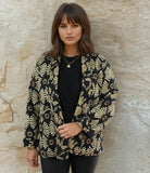 Black and gold reversible printed cotton quilted jacket.