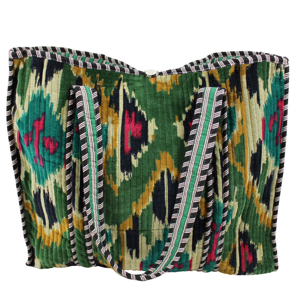 Detailed cut out of velvet ikat shopping bag lifestyle