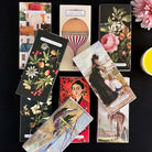 Collection of vintage-style matchboxes with artistic designs.