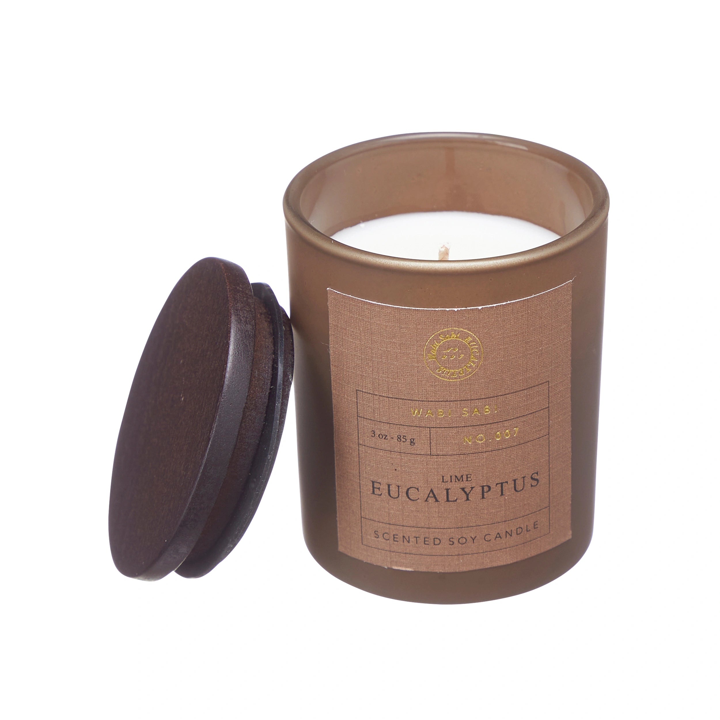 Candle in brown jar with 'Wabi Sabi Lime Eucalyptus' label.