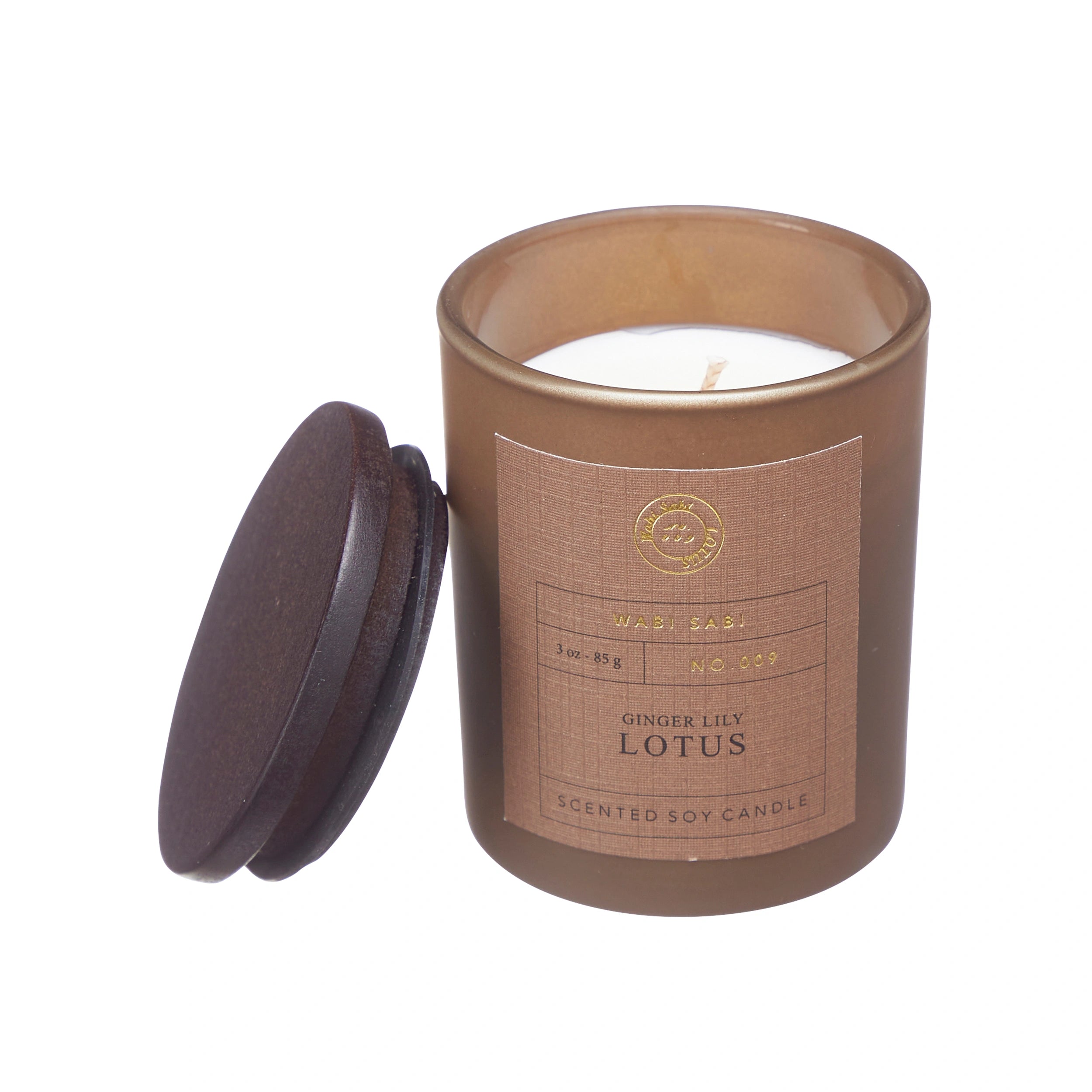 Candle in brown jar with 'Wabi Sabi Ginger Lily Lotus' label.
