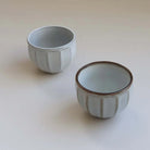 Ceramic bowl with wide stripes.