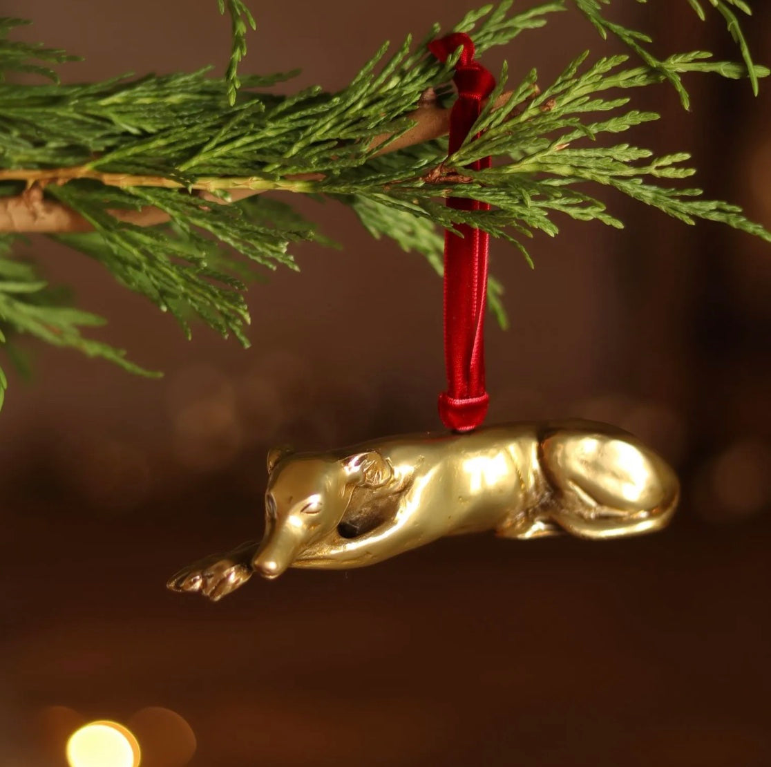 Brass Greyhound-shaped hanging Christmas ornament.
