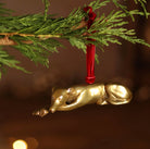 Brass Greyhound-shaped hanging Christmas ornament.