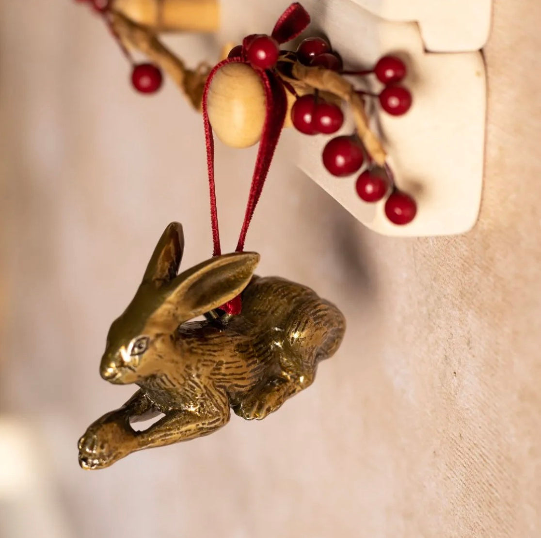 Brass hare-shaped hanging ornament.