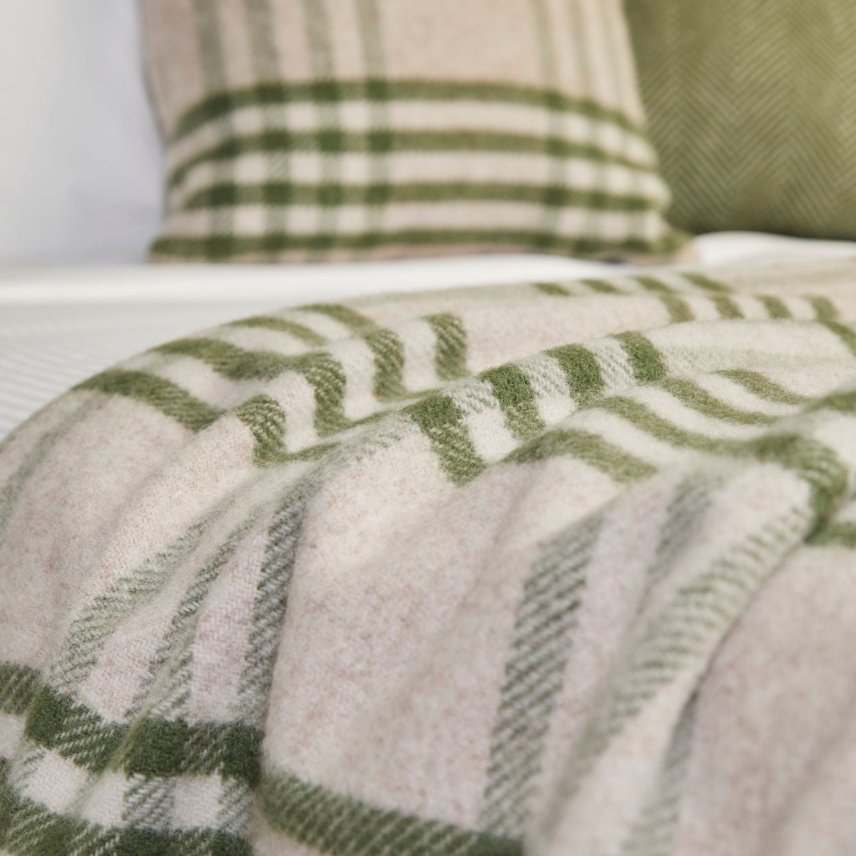 Detail of Olive Hex Wool Throw on bed
