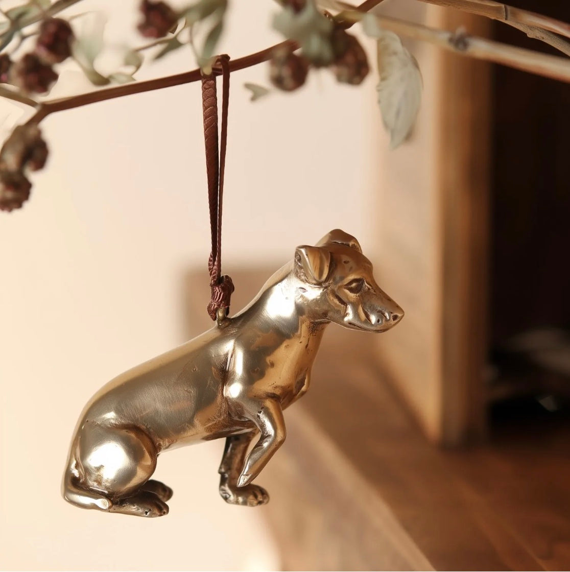 Brass Jack Russell shaped hanging decoration.