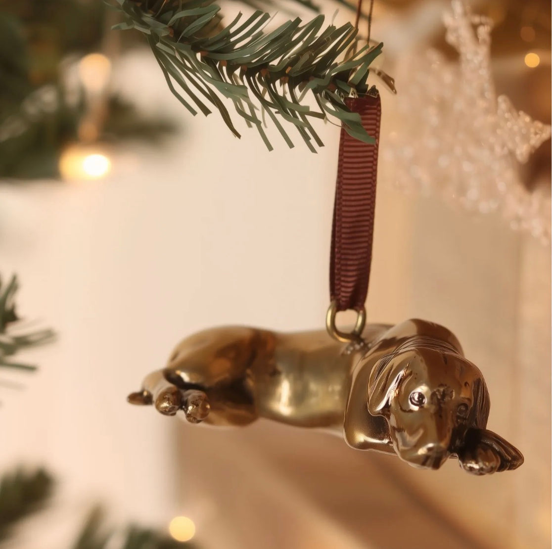 Brass labrador shaped hanging ornament.