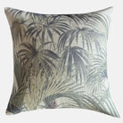 Decorative throw cushion with a fern pattern on a white background.