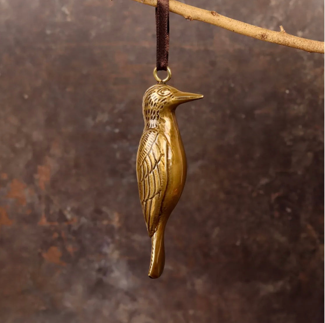 Brass woodpecker-shaped hanging ornament. 